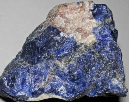 Sodalite can aid in throat chakra balancing by improving intuition, communication, and confidence