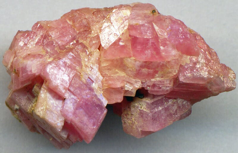 Rhodochrosite promotes emotional healing by reducing anxiety and stress