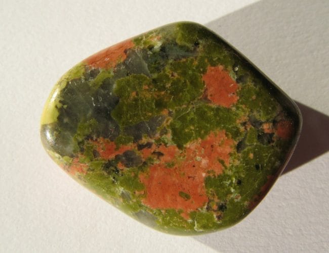 Unakite is connected to the heart chakra and benefits it by promoting spiritual development and emotional balance